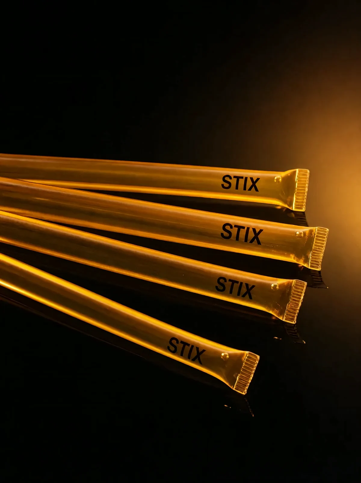 A single-serve honey pre-workout in a compostable amber straw. Bite one end, squeeze, go.